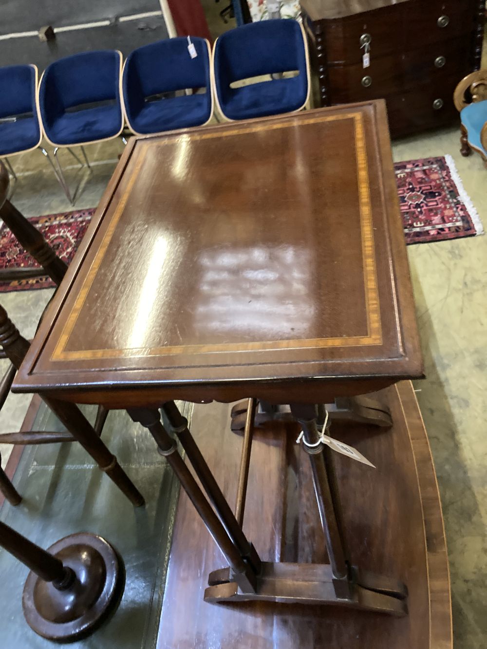 A nest of two Edwardian mahogany tea tables, width 42cm depth 34cm height 66cm